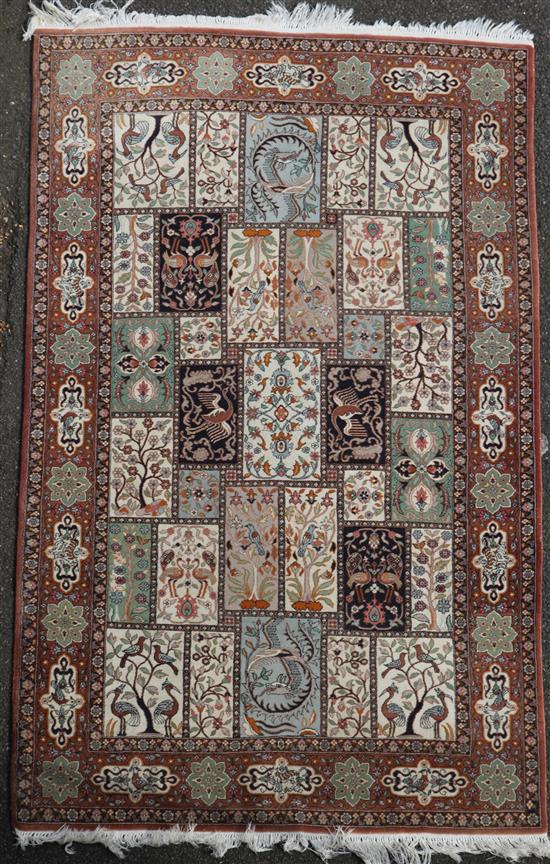 A Persian Qum style rug, 7ft 3in by 4ft 7in.